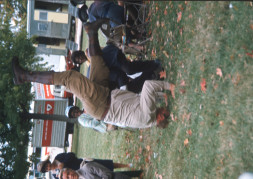 Actor Dana Elcar (Kirky) attempting a headstand in front of fellow actors.