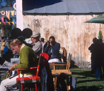 Production crew in downtown Fort Scott, Kansas. Gordon Parks, Jr. (Center) takes a photograph.