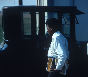 Actor Kyle Johnson (Newt Winger) approaching a black buggy.