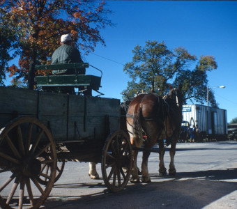 Horse and wagon going down the street in downtown Fort Scott, Kansas.