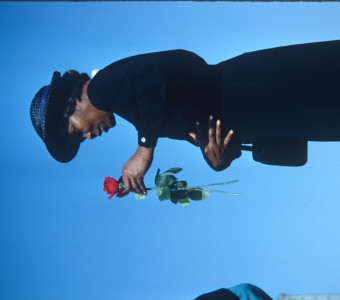 Actress Estelle Evans (Sarah Winger) holding a rose. Photograph likely taken around the time the trial scene was filmed.