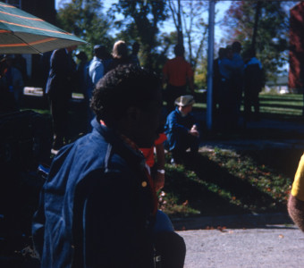 Director Gordon Parks in front of cast and crew members.