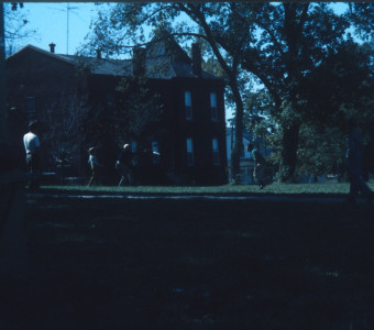 Cast and crew playing frisbee