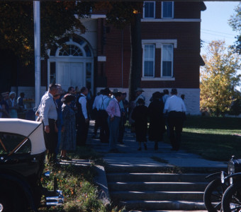 Acting cast outside of courthouse used in trial scene.