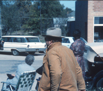 Actor Dana Elcar (Kirky) walking down a sidewalk in downtown Fort Scott, Kansas.