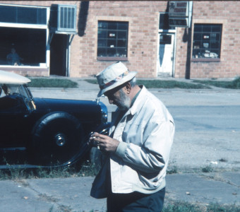 Man with camera in downtown Fort Scott, Kansas.