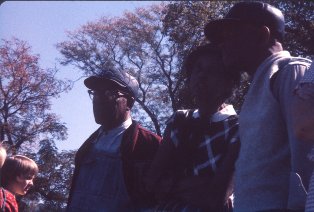 Actors and crew discussing a scene.