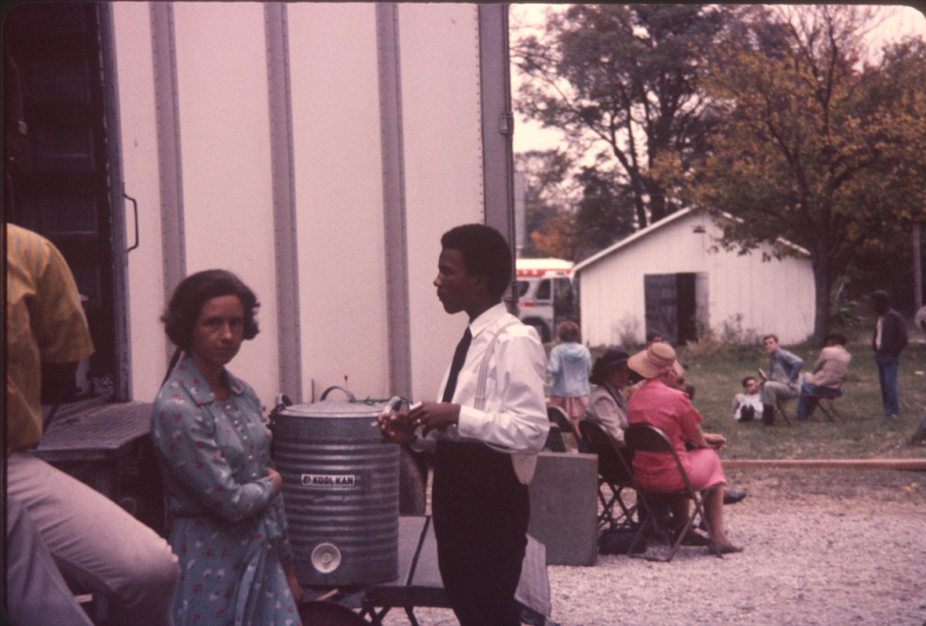 Actor Kyle Johnson (Newt Winger) wearing black tie and suspenders, on the set. The photograph was likely taken around the filming of the Sarah Winger‚Äôs funeral scene.