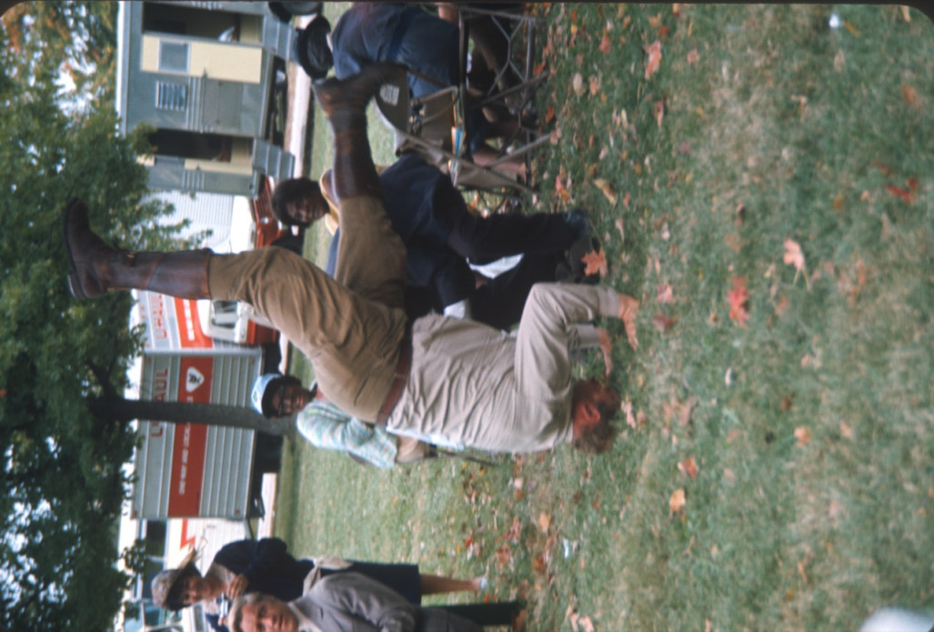 Actor Dana Elcar (Kirky) attempting a headstand in front of fellow actors.