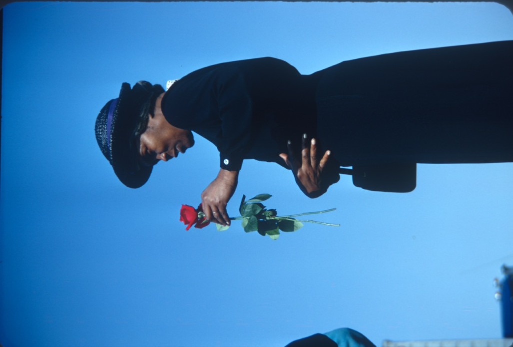 Actress Estelle Evans (Sarah Winger) holding a rose. Photograph likely taken around the time the trial scene was filmed.