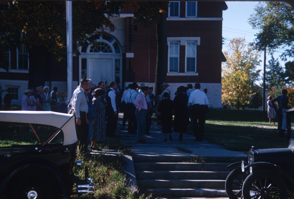 Acting cast outside of courthouse used in trial scene.