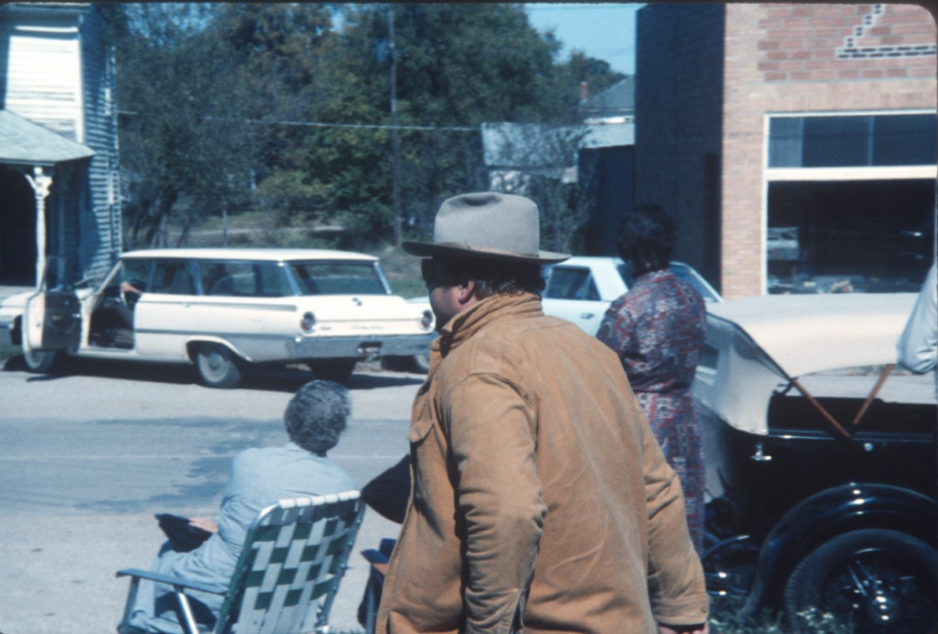 Actor Dana Elcar (Kirky) walking down a sidewalk in downtown Fort Scott, Kansas.